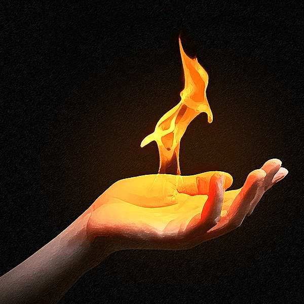 A woman's hand extends into the frame, a small column of fire blooming over her palm.
